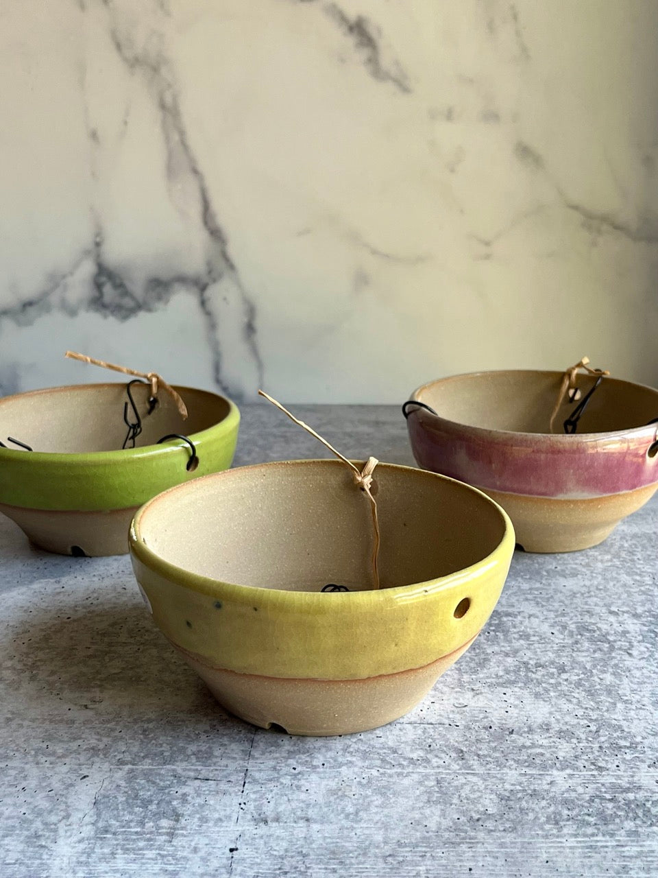 Handmade yellow stoneware hanging planter with removable chain, wheel-thrown in Ethelsville Alabama