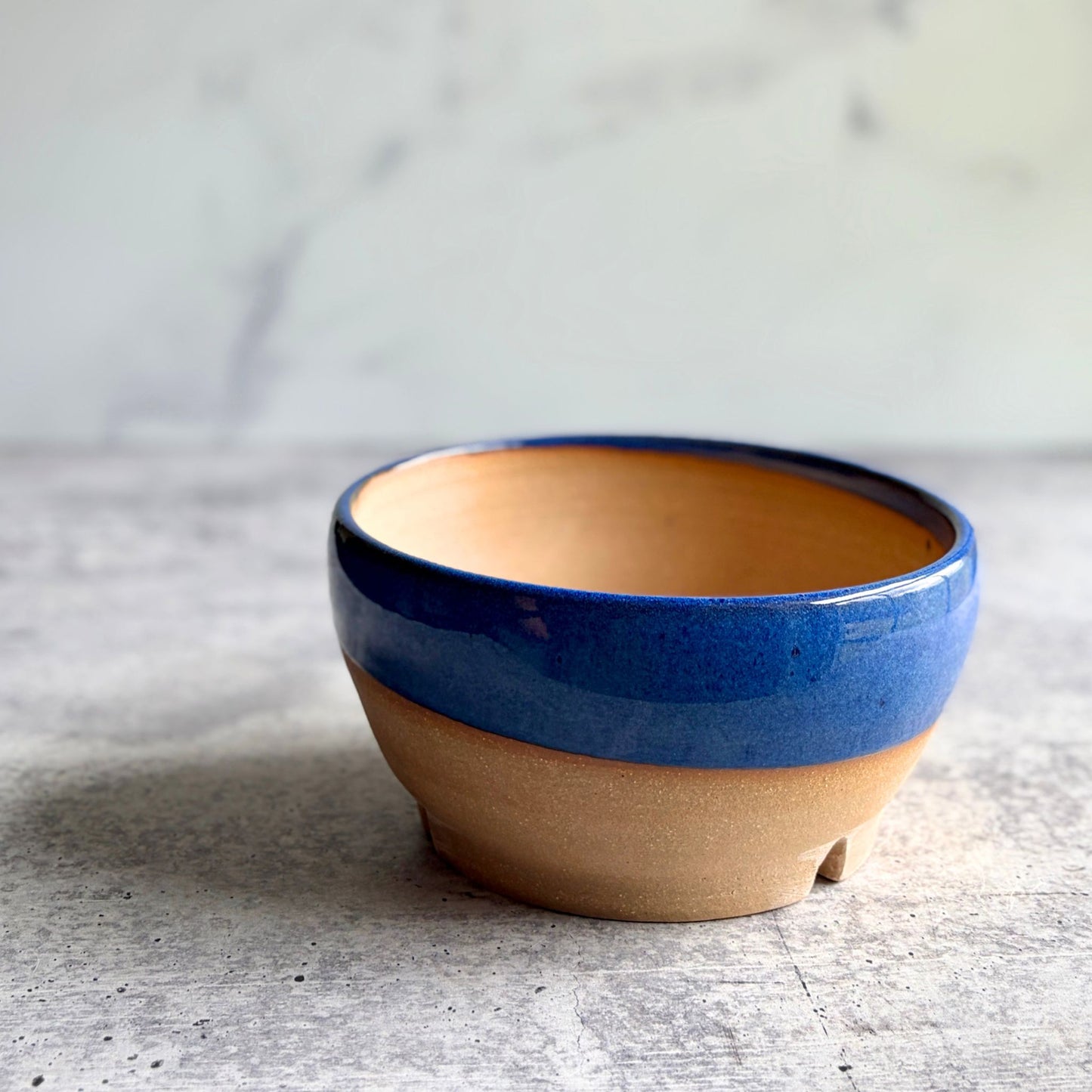 Handmade blue stoneware planter, wheel-thrown in Alabama, 6 inch round ceramic pot with drainage hole and unglazed clay base